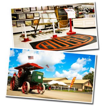 A huber sign at the museum and a steam engine outside.