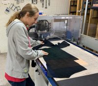 Laying the patterns on the leather begins the process at McKinley Leather