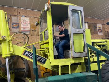 Engineering student Josh Dunn sits in one of the exhibits.