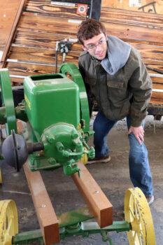Wyatt Kerr of LaRue, an engineering student at Marion Tech, tried to start a John Deere engine by turning the fly wheel.