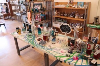 A photo of the store filled with small items such as tumblers, keychains, chocolates and other goods.