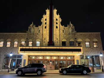 A photo of the Palace Theatre at night. 
