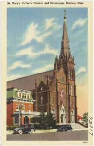 A picture of the current brick church with soaring spires. 