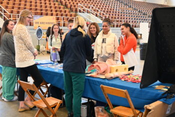 Students talk with OhioHealth representatives. 