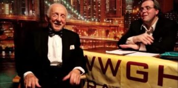 A radio hosts interviews George, an elderly man in a tuxedo who is smiling.
