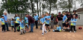 Unstoppable players and players from the Marion Merchants mill on the field. 