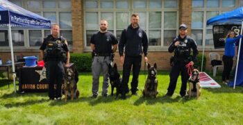 Local canine officers and their handlers at the Marion K9 Project Cornhole Tournament and car show. 