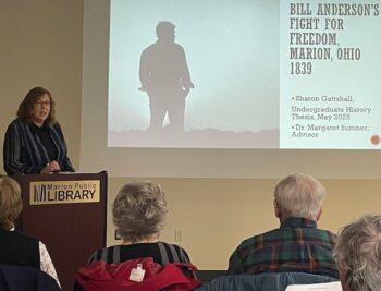 A woman presents at the Marion Public Library. 