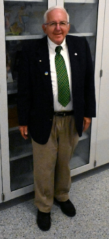 A white-haired man in a suit smiles. He helped found MAPP in 1980.